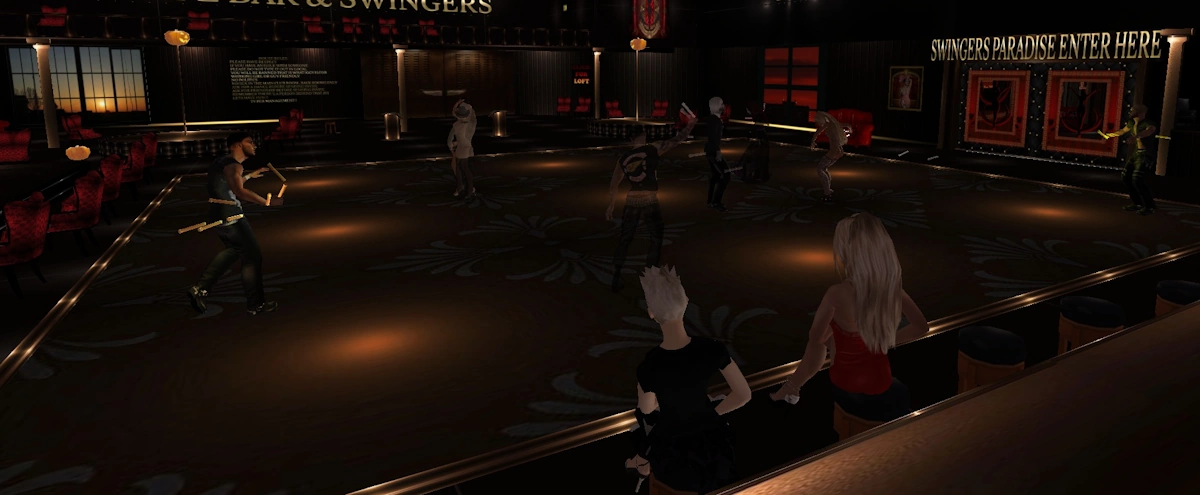 Two female avatars waiting to be asked to dance in Red Light Center